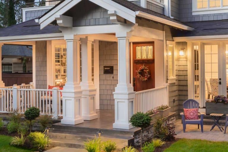 Front porch of a house with modern interior and christmas wreath on the front door, 31 Modern Front Porch Ideas You Should Check Out [Picture Post]