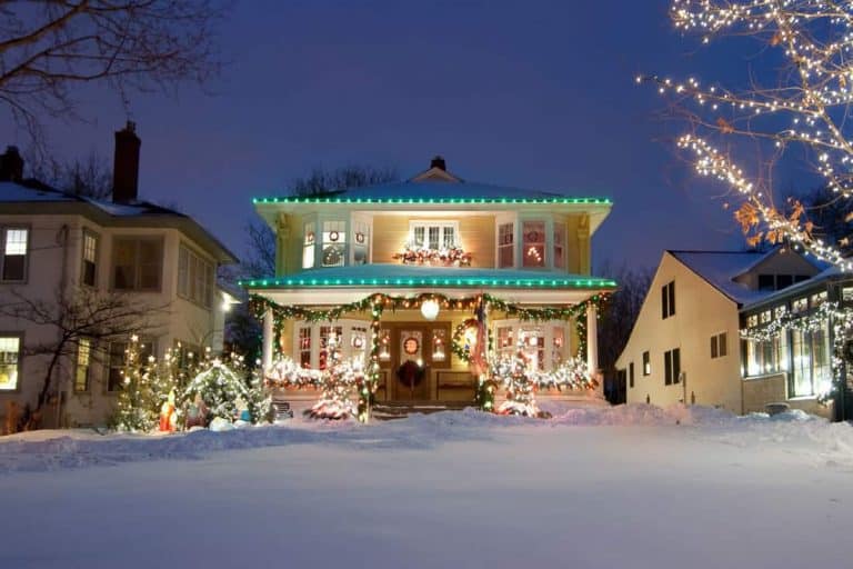 Luxurious house with christmas lights attached on the porch and fascia boards, 15 Christmas Porch Decorating Ideas [With Pictures]