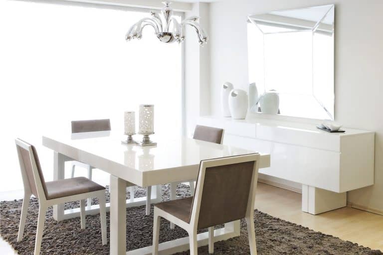 all white dining room with large rectangular mirror and gray carpet, 11 Awesome Dining Room Mirror Ideas