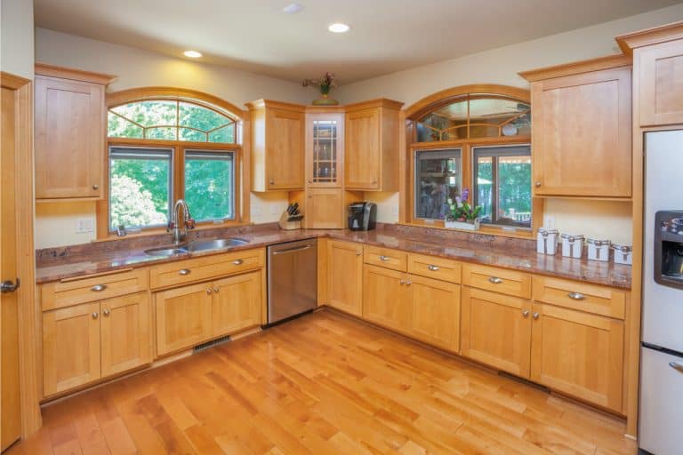 Kitchen With Hardwood Floor, Cabinetry, and Marble Counters. What Color Quartz Countertops Go With Maple Cabinets
