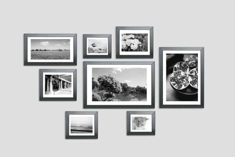 Different sized picture frames hanged on the wall, Where To Buy Wall Paintings For Living Room [Top 25 Places Offline And Online]