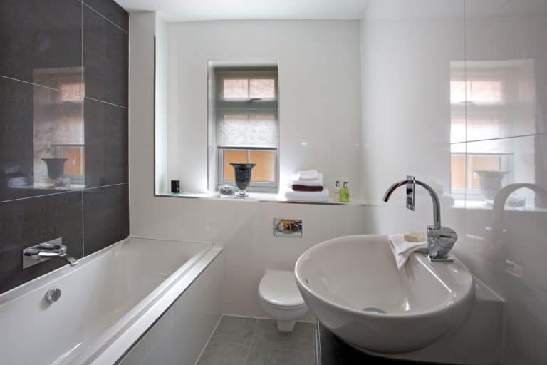 Modern contemporary interior of a bathroom with white and gray tiled walls, How To Repair A Hairline Crack In A Porcelain Sink [6 Simple Steps To Follow]