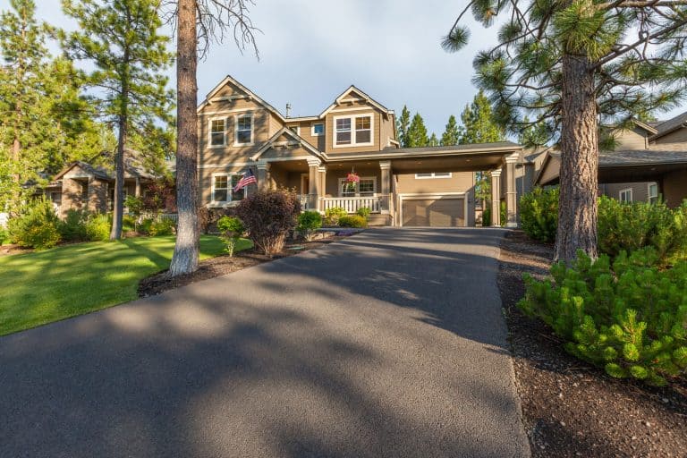 Front elevation and asphalt driveway of a beautiful home, 21 Asphalt Driveway Ideas To Inspire You