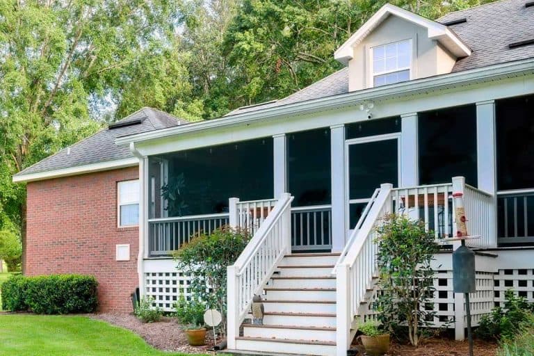 Colonial brick house with covered back porch with large yard, 15 Porch Overhang And Roof Ideas To Inspire You