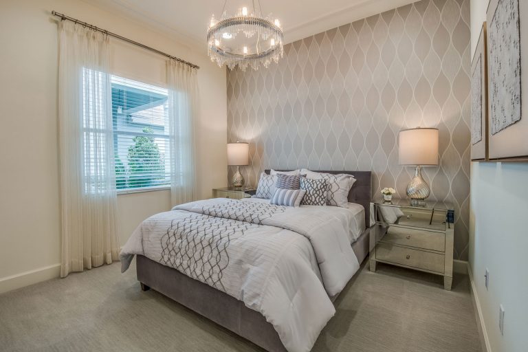 Beautiful bedroom with decorative wallpaper and sheer curtains, Does Wallpaper Last Longer Than Paint?