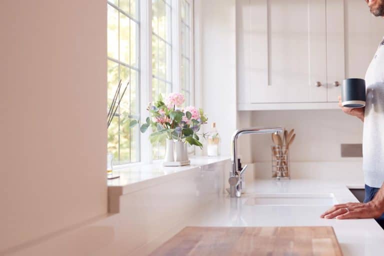 White kitchen countertop with chrome faucet, What Color Cabinets Go With White Countertops?