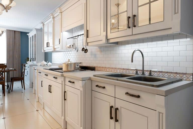 Open space kitchen and dining room inspired from a Mediterranean accent, What Color Cabinets Go With Cream Countertops?