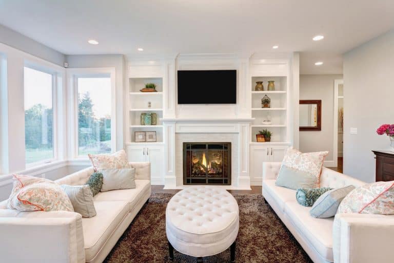 furnished living room in newly constructed home, How Much Space Between Electric Fireplace And TV?