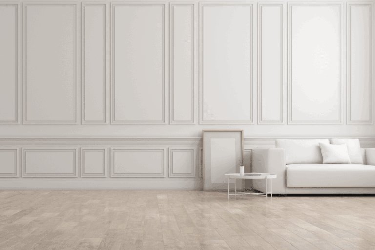 white living room in classic style with furniture on bright laminate floor ang raised wall panelling.