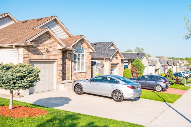 New residential neighborhood with row of detached houses - How Much Weight Can A Driveway Hold