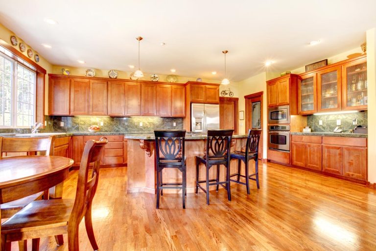 A luxury beautiful large cherry wood kitchen with green tile back splash and yellow walls, How To Make Cherry Wood Furniture Look Modern