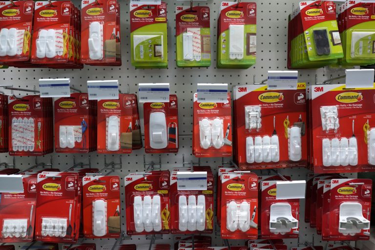 Row of Command brand Picture Hanging Strips and Hooks by 3M company on store shelf. 3M is the general public primarily known for the Post-it Notes and Scotch Tapes. - Can You Use Command Strips On Wallpaper