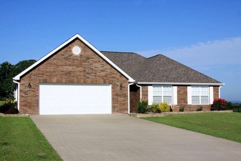 New Construction Generic Brick House with concrete driveway, 21 Beautiful Concrete Driveway Ideas