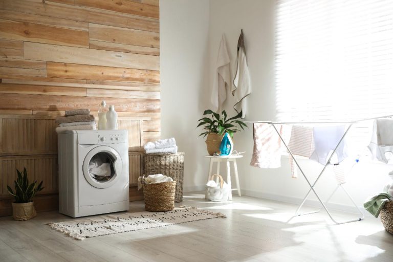 Stylish room interior with modern washing machine and drying rack, 15 Wall Decor Ideas For Laundry Room