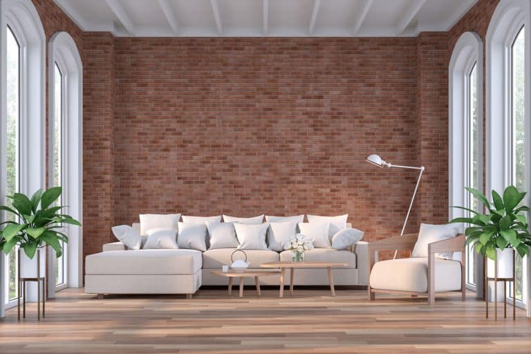Modern contemporary living room with empty red brick wall