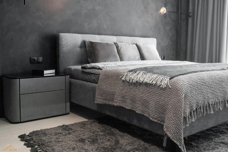 A modern room with trendy gray interiors, What Color Nightstand Goes With Grey Bed? [7 Color Combinations To Try!]