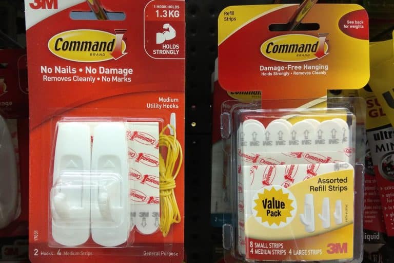 Command brand Picture Hanging Strips and Hooks by 3M company on store shelf, How Much Weight Can A Command Strip Hold [Inc. Small, Medium, Large, Extra Large]?