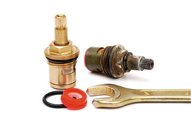 brand new and used ceramic disc cartridges, gaskets and wrench isolated on white background, Moen Cartridge Won't Go All The Way In - Why? What To Do?