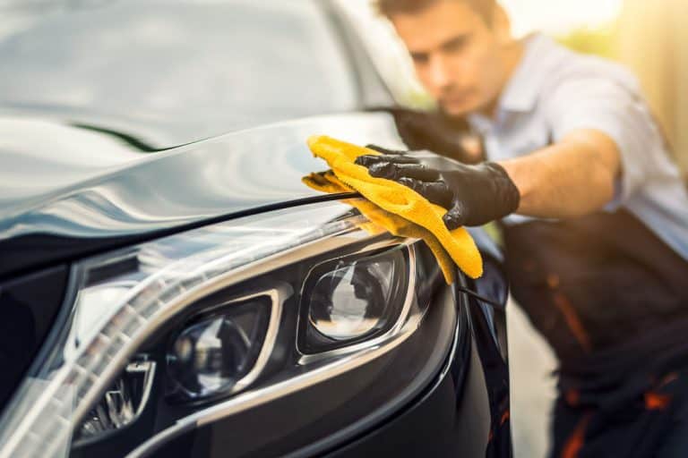 Car detailing - the man holds the microfiber in hand and polishes the car. Selective focus., Are Mineral Spirits Safe For Skin?