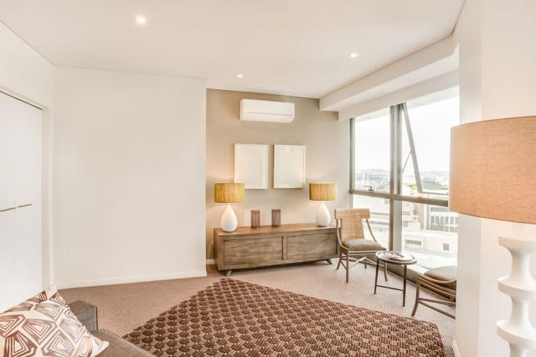 Minimalist bohemian inspired apartment living room, Sherwin-Williams Pure White Vs. Extra White: What's The Difference?