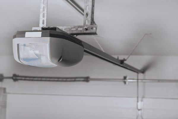 Electric garage door opener installed in garage, Can A Garage Door Opener Be Too Powerful? Choosing The Right Horsepower