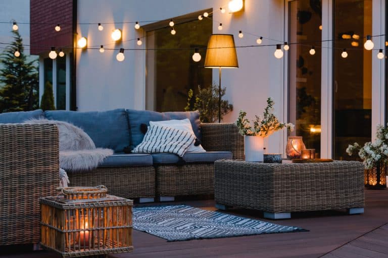 Summer-evening-on-the-patio-of-beautiful-suburban-house-with-lights-in-the-garden-garden