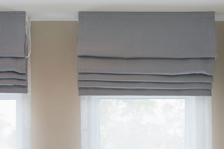 closed up of beautiful grey curtain in cozy room home, interior design concept, Do Roman Shades Block Light