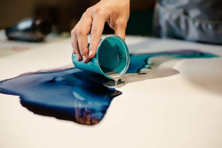 Pouring epoxy paint on to a board